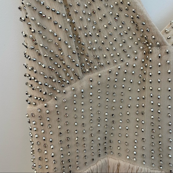 Free People Cream sparkly mini dress with a strappy back!
Size: 2 Never worn! - Picture 3 of 4
